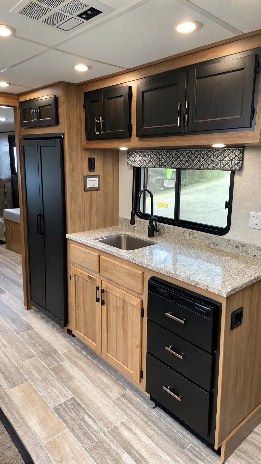 RV interior with two-tone black and wood cabinets