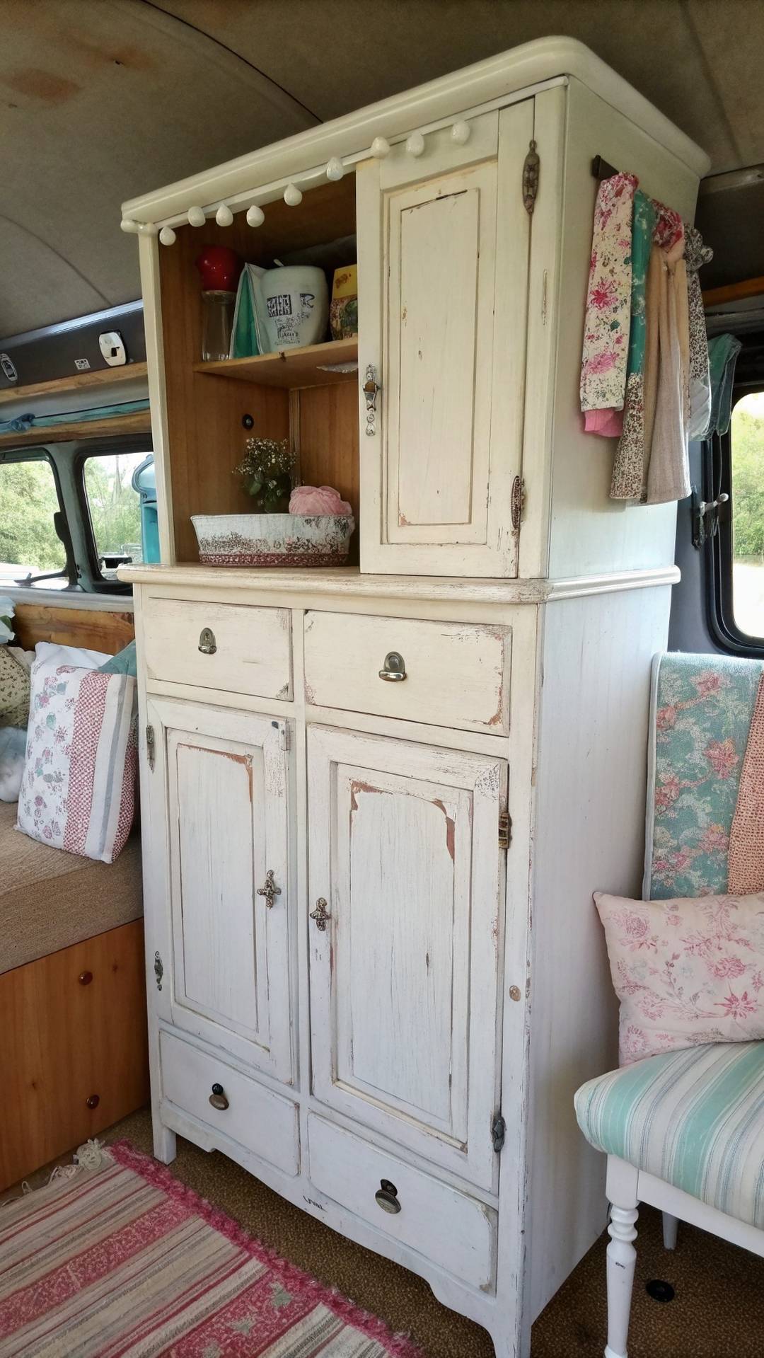 Distressed white furniture in shabby chic camper